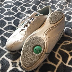 Green and white PUMA shoes